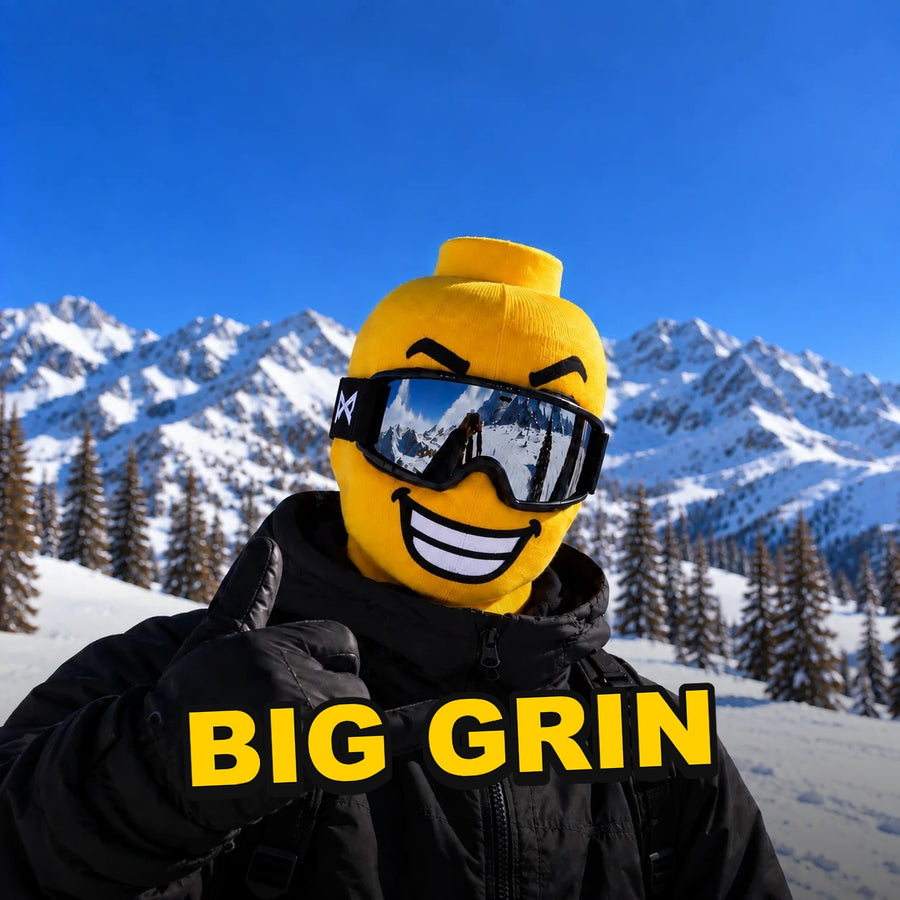 Skier in a yellow Originals face mask with a big grin